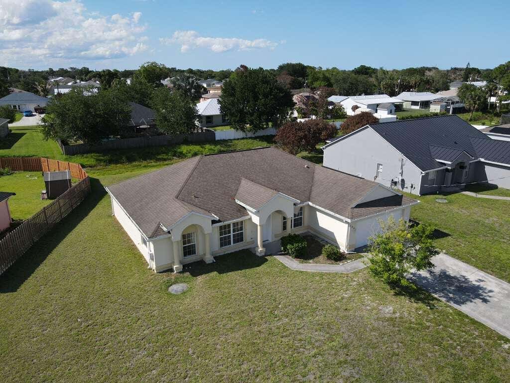 Photo of 1061 SW Coleman Avenue, Port Saint Lucie, FL 34953 (MLS # B26061485)