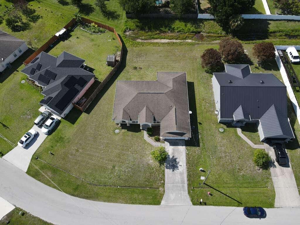 Photo of 1061 SW Coleman Avenue, Port Saint Lucie, FL 34953 (MLS # B26061485)