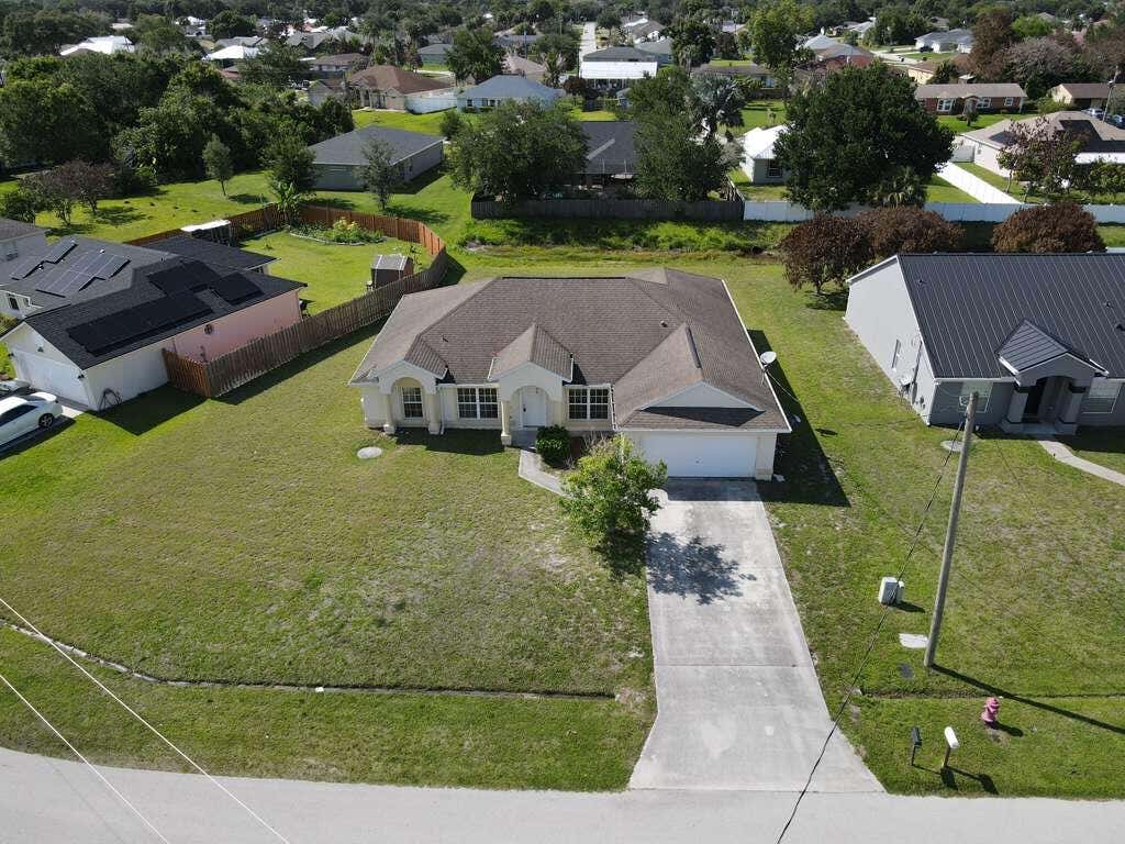 Photo of 1061 SW Coleman Avenue, Port Saint Lucie, FL 34953 (MLS # B26061485)
