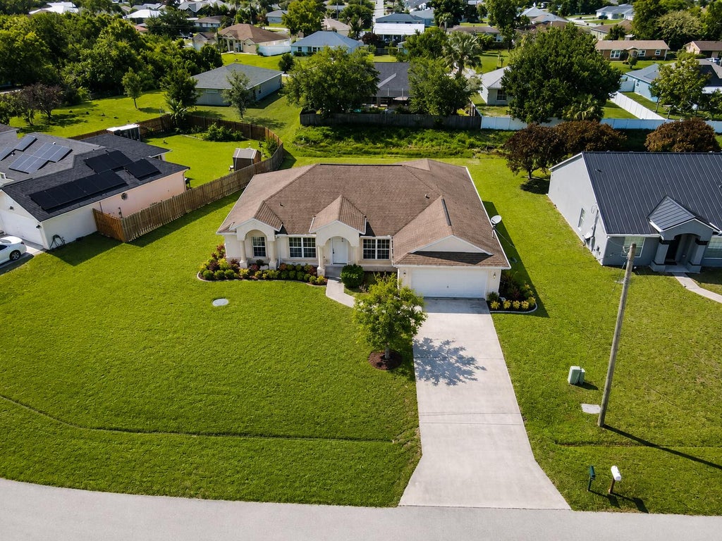 Photo of 1061 SW Coleman Avenue, Port Saint Lucie, FL 34953 (MLS # B26061485)