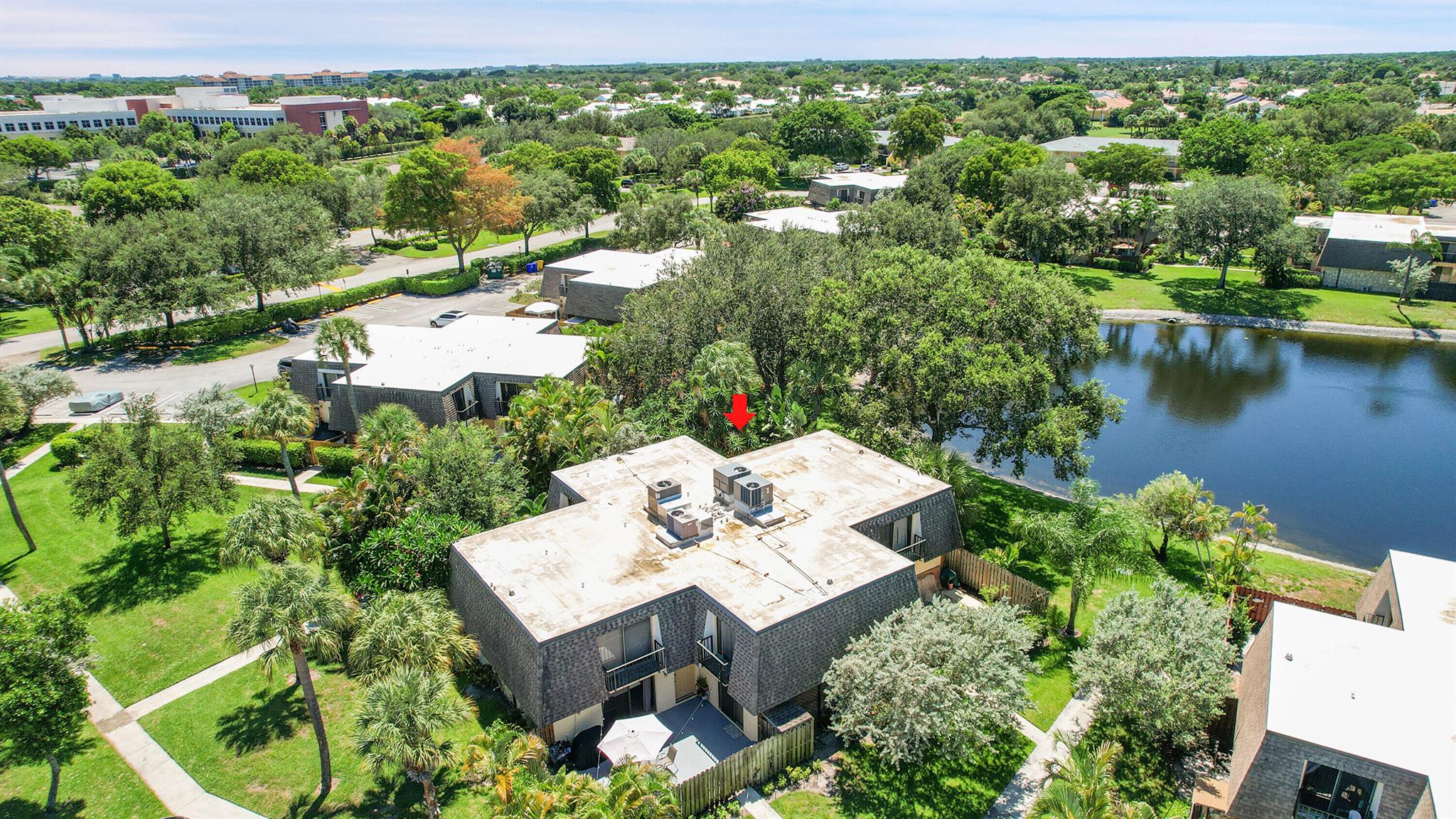 Serene 2-bedroom, 2-bath corner, courtyard townhome offering shimmering lake views from a secluded patio with privacy fence, framed by lush, verdant landscaping that invites peace and relaxation. Completely refreshed with thoughtful updates throughout, including custom book shelves, fresh paint, 2020 AC, NEW water heater, tile and carpet. Delray Oaks West is an all age community that offers a clubhouse w pool, fitness center, tennis & pickleball....& is just minutes away from downtown Delray Beach & Mizner Park, renowned restaurants, boutiques, cultural venues, public golf courses & the sun kissed Florida Shore. Unit offers accordion shutters and assigned parking. Plenty of guest parking, Pet friendly and investor's welcome!