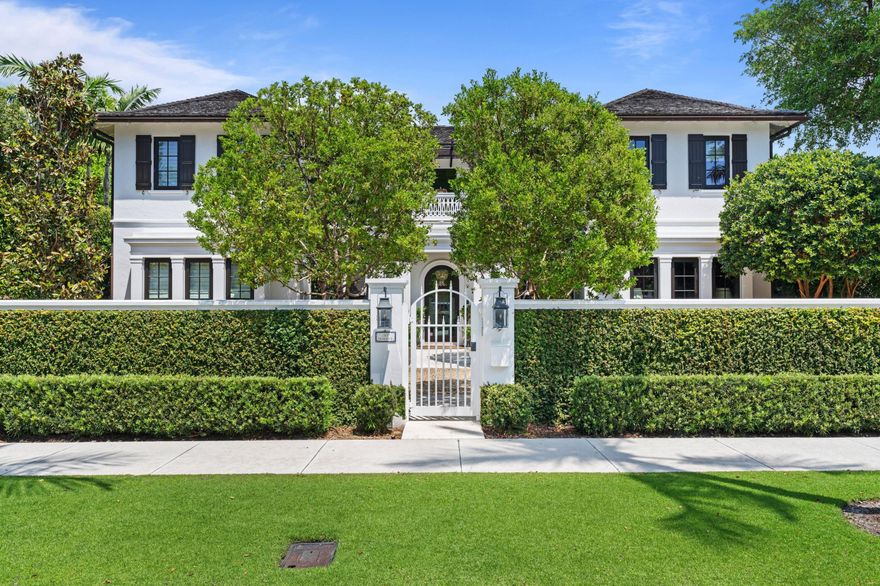 Luxurious in-town living at its finest! No detail has been overlooked in this stunning estate located on one of Palm Beach's most desirable streets. An inviting entry leads to a light-filled formal living , an entertainer's dream bar with walk-in wine cellar and 2 en-suite guest rooms. The gourmet kitchen, with butler's pantry, formal dining and family living room all graciously lead to the inviting, pool-side loggia that is a private oasis that completes the first floor. Head up the staircase, open the French doors to your private patio and welcome in the sound of waves lapping on the sand from your serene master bedroom with spacious walk-in his/her baths + closets. Enjoy 2 additional guest suites to welcome family/friends. This exquisite gated property is the epitome of PB living.