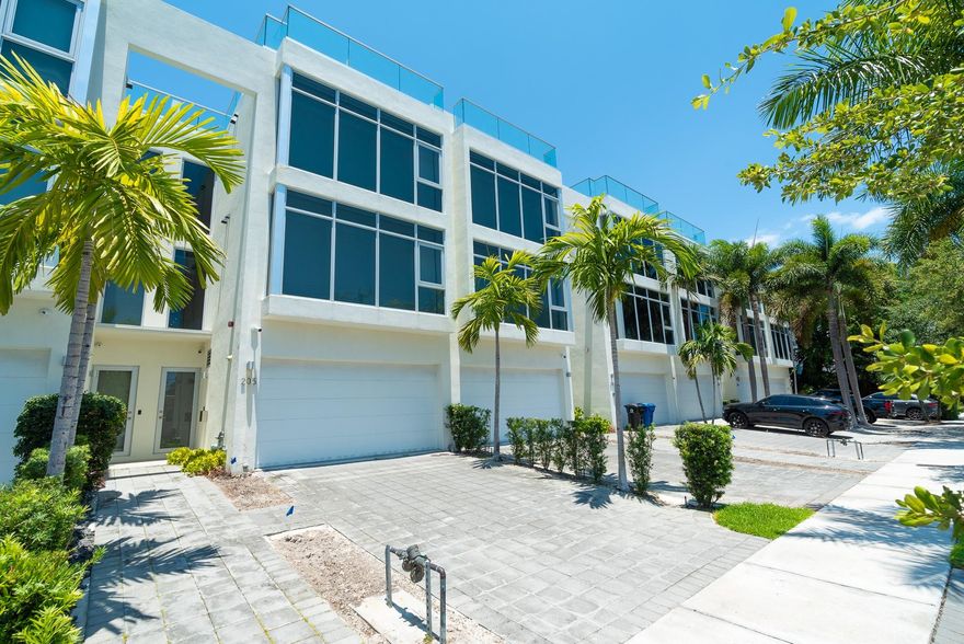 Fisher Auction Company is pleased to present this magnificent, luxury waterfront townhome in “Acqua Marina” on prestigious Hendricks Isle in Ft. Lauderdale, FL. This massive 7,412± square foot 6 bedroom, 5.5 bathroom upscale townhome was built to impress. Originally built in 2020, the townhome features major upgrades including: floor-to-ceiling windows with custom electronic blinds, a Generac Protector whole house generator, a magnificent Chefs Kitchen with exclusive Miele appliances including refrigerator/freezer, conventional oven, stovetop, microwave and convection oven, coffee/cappuccino maker, warming oven and 2 dishwashers, custom counter tops, custom remote controlled lighting throughout, complemented by 9’ ceilings, solid wood 8’ high doors with high end hardware and so much more!