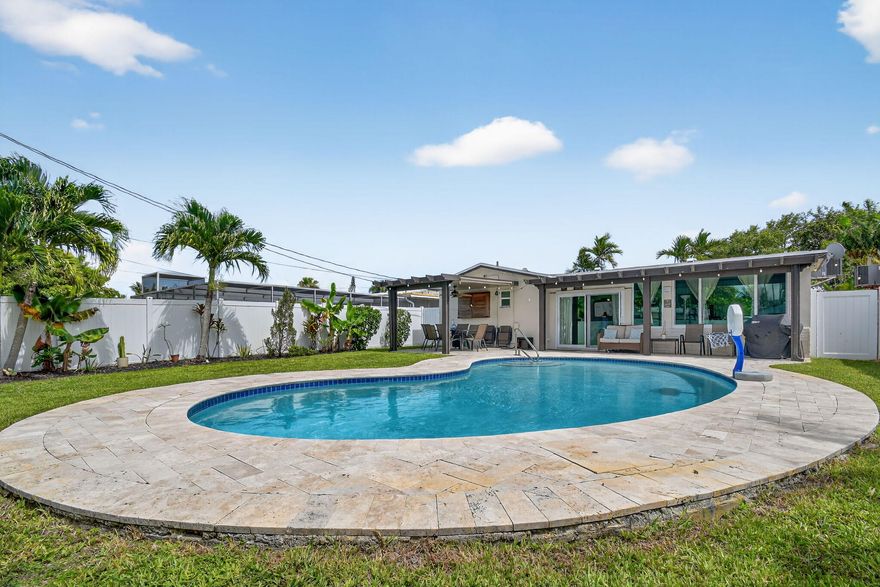 Beautifully maintained pool home with numerous upgrades and no HOA! Remodeled bathrooms (2018), updated travertine patio (2020), and resurfaced pool (approx. 2013). Roof, fence, and electrical panel all new in 2023. Hurricane-impact windows (2017) and aluminum awnings (2016) provide added peace of mind. 4-ton AC with UV light (5 yrs old), sewer lines just cleaned, and 3-year-old water heater. Converted 4th bedroom with private bath perfect for a guest suite, gym, or office. Features include all-tile flooring, new fans and light fixtures, stylish black hardware on all doors, and lush landscaping with well-fed sprinklers. Enjoy the private backyard oasis with ample outdoor living space. Located near hospitals, shops, and more. This one has it all!