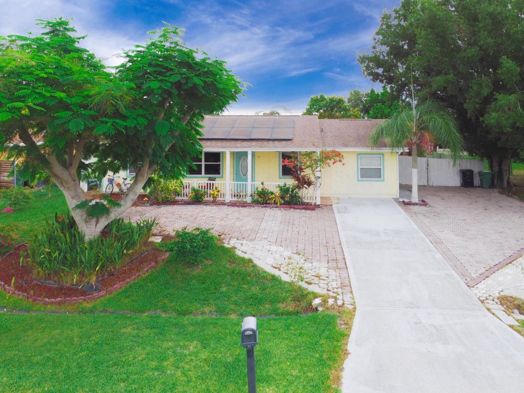 Photo of 1913 SW Idaho Lane, Port Saint Lucie, FL 34953 (MLS # R11096748)