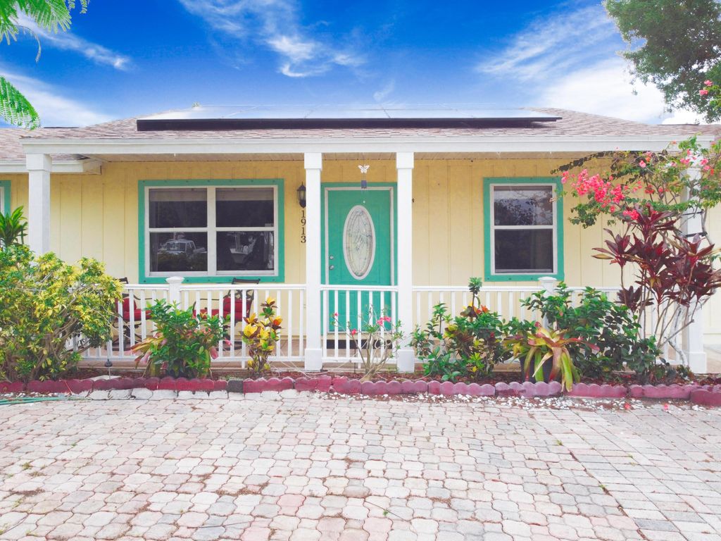 Photo of 1913 SW Idaho Lane, Port Saint Lucie, FL 34953 (MLS # R11096748)