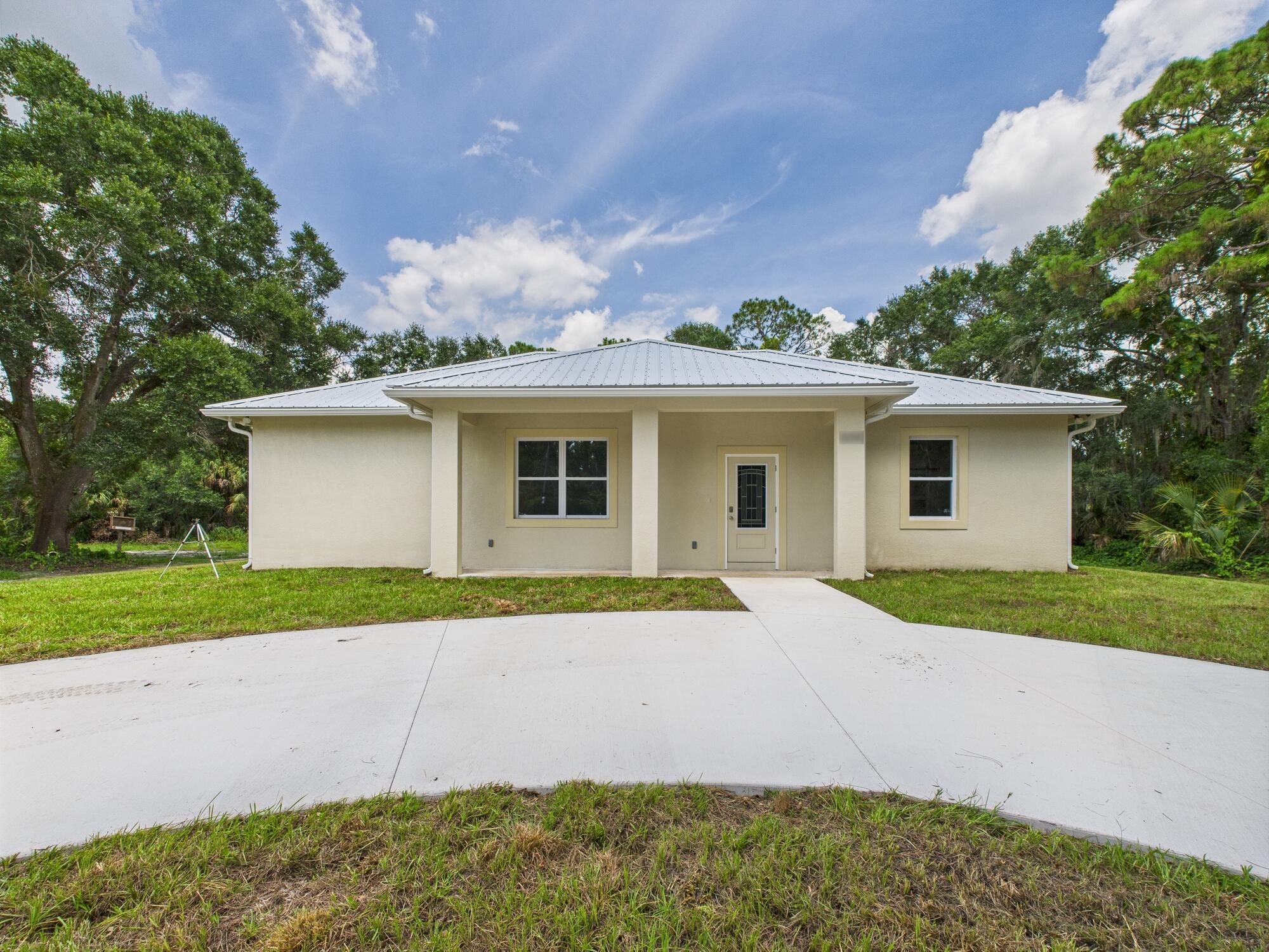 CLOSING COST INCLUDED, Brand new 3BD/2BA luxury home on a quiet street on Okeechobee's east side--ideal for commuters! This home features upscale trim, coffered ceilings, a huge island kitchen with solid counters, custom cabinets, and luxury lighting. The open layout flows into a spacious living area with tray ceilings. The master suite offers a large walk-in closet, and two frosted glass doors--one to the oversized shower and one to the water closet. Also includes inside laundry, full video security system, circle drive, and tree-lined privacy.