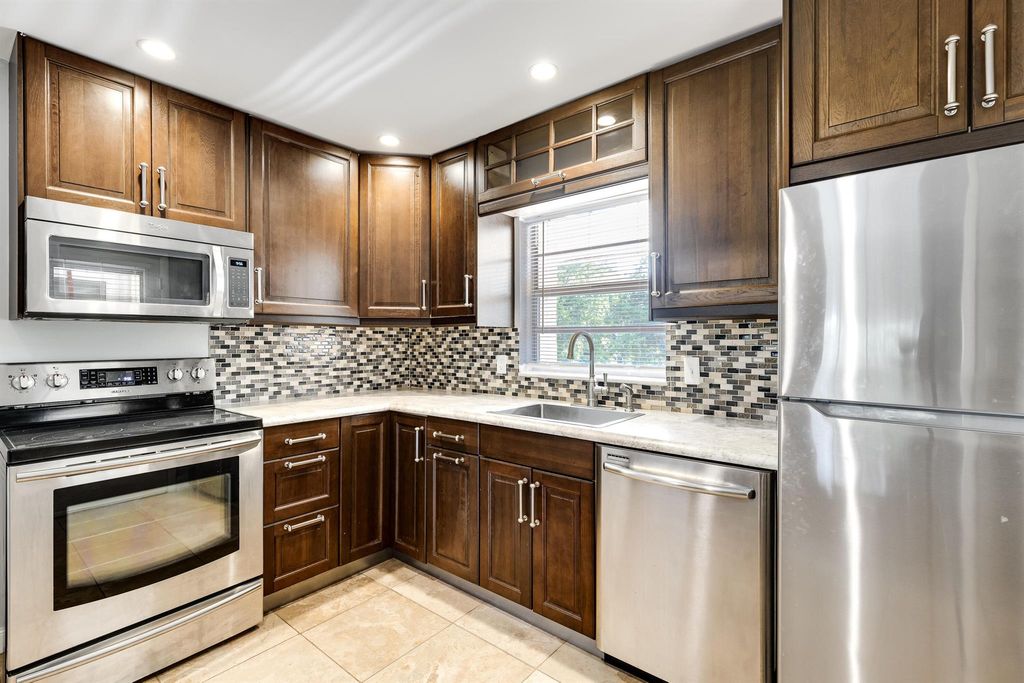 Photo of 10693 N Military Trail #8, Palm Beach Gardens, FL 33410 (MLS # R10998372)