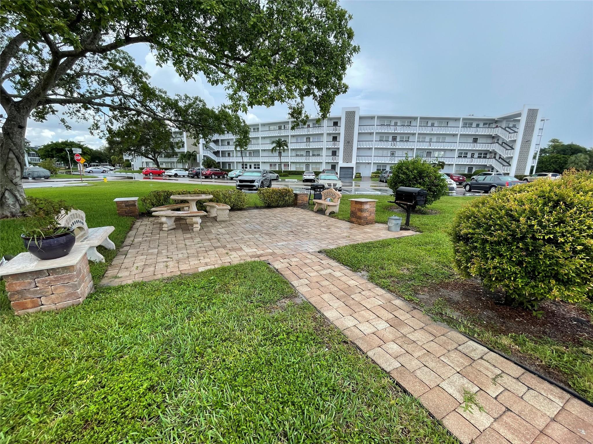 Lovely 1 bedroom, 1 bath, 2nd floor condo in Garden Style Building. Located in active adult community in the heart of Deerfield Beach. Paved BBQ area in front of building for get togethers! NEW ROOF - MAY 2025! Open kitchen, large ceramic tile through out. Newer A/C wall unit, HWH 2 years old. Beautiful French Doors in bedroom! CVE offers resort style amenities galore including a lavish clubhouse, 1,500 seat theater, premier performances, shuttle buses, state of the art gym, pickleball, putting greens, tennis, indoor & outdoor pools, movies, classes of every type & more! Close to shopping, restaurants & beach. Assoc. claims 55+.