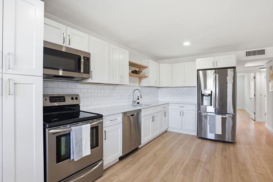 Welcome to this beautifully fully renovated 2-bedroom, 2-bathroom second-floor condo offering serene, endless water views from your spacious private screened patio the perfect setting to relax and unwind. This bright and inviting unit features brand new vinyl laminate throughout and a functional layout with two full bathrooms. Located in the highly desirable Century Village, a vibrant 55+ community known for its resort-style living, residents enjoy 24/7 gated security, a clubhouse, fitness center, heated pools, tennis courts, mini golf, and convenient bus service. Ideally situated just minutes from the beach, shopping, and dining this is South Florida living at its best! Furniture is negotiable! Building has a new roof as well!