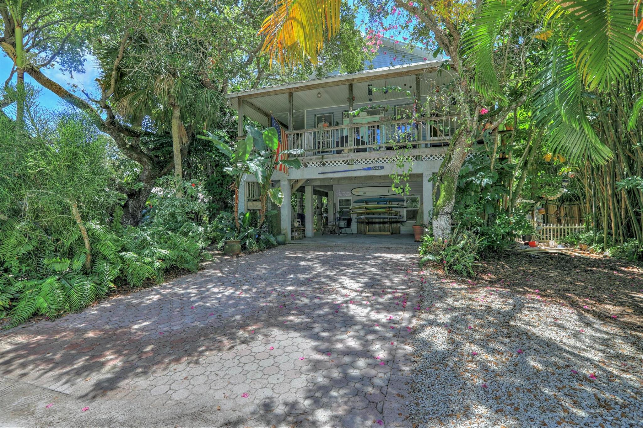 Welcome to your Florida Beach Retreat in Summerplace. This 5-bedroom, 3-bathroom home offers granted beach access. The property also features an income-producing 2-bedroom apartment, allowing you to live in the main home while generating revenue from the lower-level unit. Enjoy the wrap-around porch, a fully renovated kitchen, and the convenience of being within walking distance to the ocean. With lush tropical landscaping and the best price per square foot in Summerplace, this home offers the perfect combination of charm, income potential, and a prime location.
