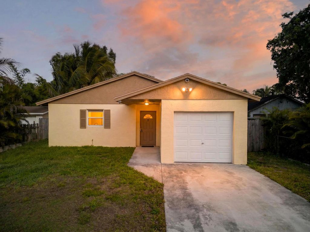 Photo of 328 Jennings Avenue, Greenacres, FL 33463 (MLS # B26006159)