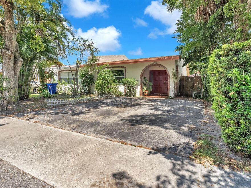 $10,000 Seller Credit!! NO HOA! This 2 bed/2-bath single-family "villa style" attached home features a spacious living/dining room, plus an oversized den/office added in 2024. Upgrades/updates include: Roof (2023), flooring (2024), built-in closets in hall & primary bedroom (2024), impact windows (2022/2024), and water heater (2022). The open layout offers comfort & functionality, perfect for entertaining or relaxing. Step outside to enjoy your side, and rear patios, along w/fruit trees—Mango, Sweetsop, Ackee, Custard Apple, Moringa & Coconut. Conveniently located near supermarkets, shops, and restaurants, this move-in ready home combines modern updates with everyday convenience. It's zoned for commercial use if you work from home and has a separate entrance! Access to Turnpike/I95/US-441.