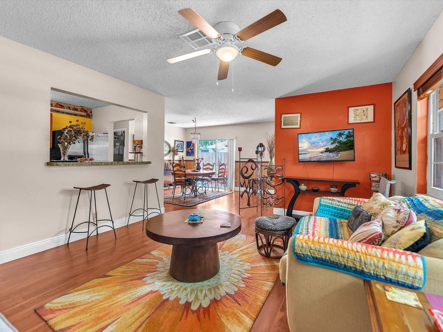 PRICE IMPROVEMENT: 2 bed, 2-bath single-family home located in Margate. It features a spacious living and dining room, plus an oversized den/office added in 2024. Upgrades/updates include: A/C (2022), Roof (2023), flooring (2024), built-in closets in hall and primary bedroom (2024), and impact windows (2022 & 2024). The open layout offers both comfort and functionality, perfect for entertaining or relaxing. Step outside to enjoy your side, and rear patios, along w/fruit trees—Mango, Sweetsop, Ackee, Custard Apple, Moringa and Coconut. Conveniently located near supermarkets, shops, and restaurants, this move-in ready home combines modern updates with everyday convenience. Experience comfort, convenience, and freedom in this beautifully updated home in Applegreen Subdivision – NO HOA!