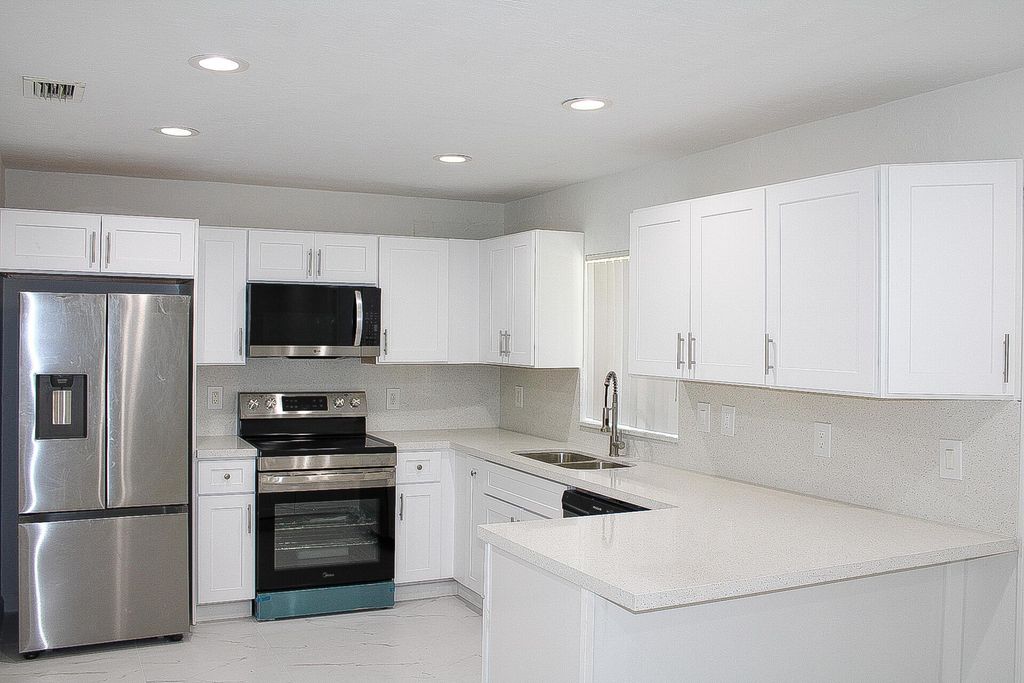 Photo of 2001 NW 2nd Street, Boynton Beach, FL 33435 (MLS # R11110698)