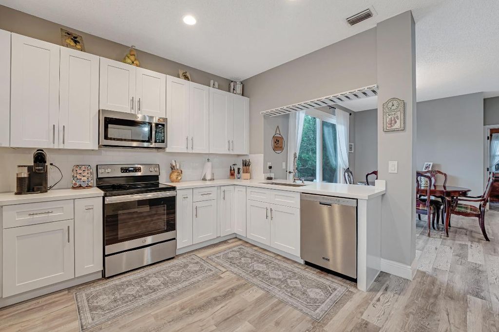 Photo of 136 Caribe Court, Greenacres, FL 33413 (MLS # R11121434)