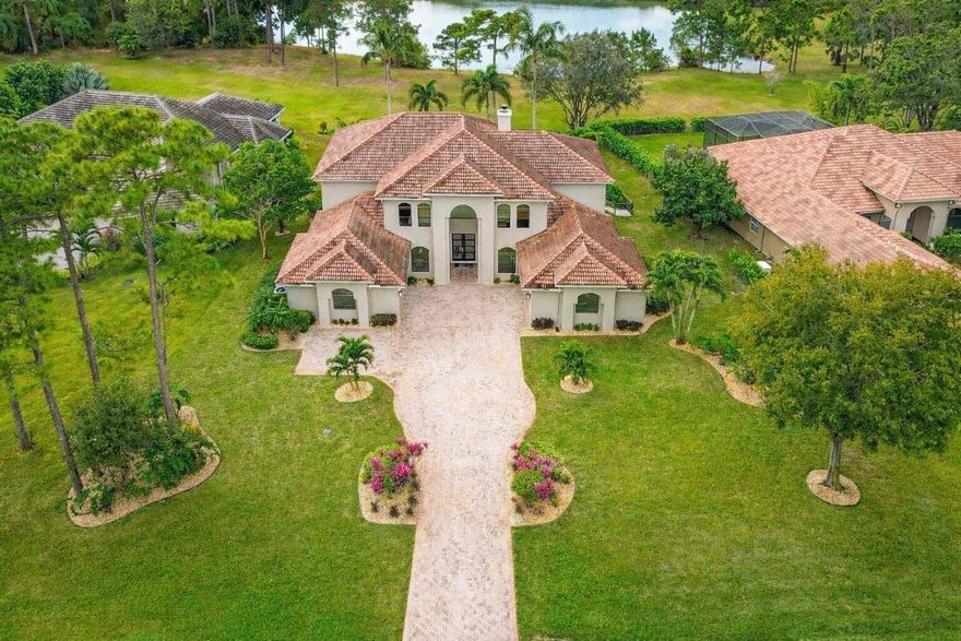 Welcome home to Sw Lands End Place. This exceptional estate style residence has been completely remodeled and is truly move-in ready, perfect for your next forever home. 
Offering 5 bedrooms, 5 full bathrooms, plus a dedicated office and upstairs den ideal for a mother-in-law suite or optional 6th bedroom. This home delivers space, flexibility & sophistication.
The oversized driveway leads you to the grand entry and two separate 2 car garages (totaling 4 car parking), all featuring new epoxy flooring with interior access. Thoughtful upgrades abound, including impact windows & doors, new flooring throughout, a fully remodeled chef's kitchen with top of the line Thermador SS appliances, all bathrooms beautifully renovated, new whole home generator, new ac systems ,and more. Outdoors, enjoy a spacious covered lanai with serene lake views, brand new salt water resort-style pool & spa and a newly fenced in yard perfect for the children, pets or entertaining. This is a rare opportunity to own a turnkey estate home in the sought after Cobblestone community of Palm City. Don't miss it.