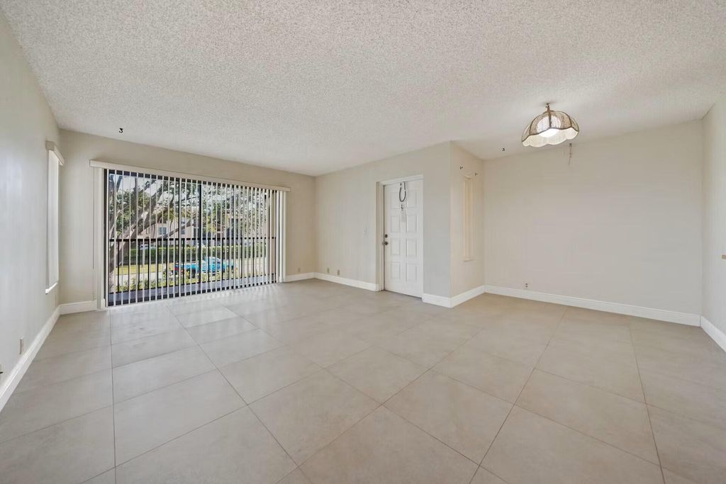 Photo of 802 Sky Pine Way #F2, Greenacres, FL 33415 (MLS # B26035377)