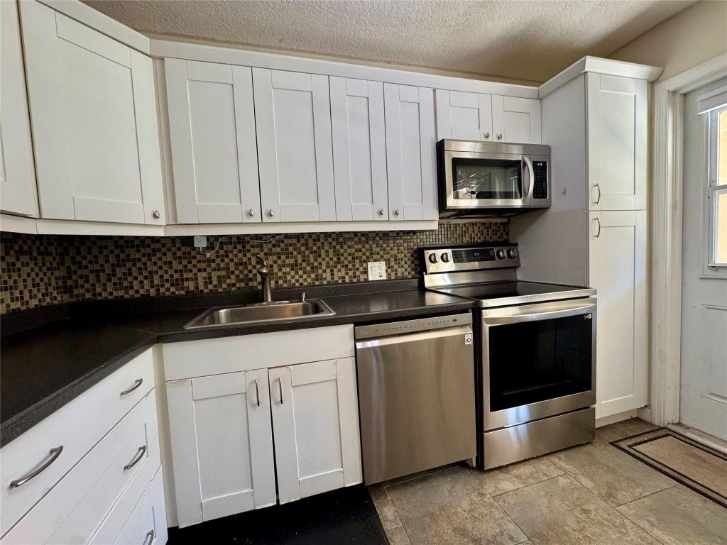 Photo of 2601 S Course Drive #305, Pompano Beach, FL 33069 (MLS # F10543416)