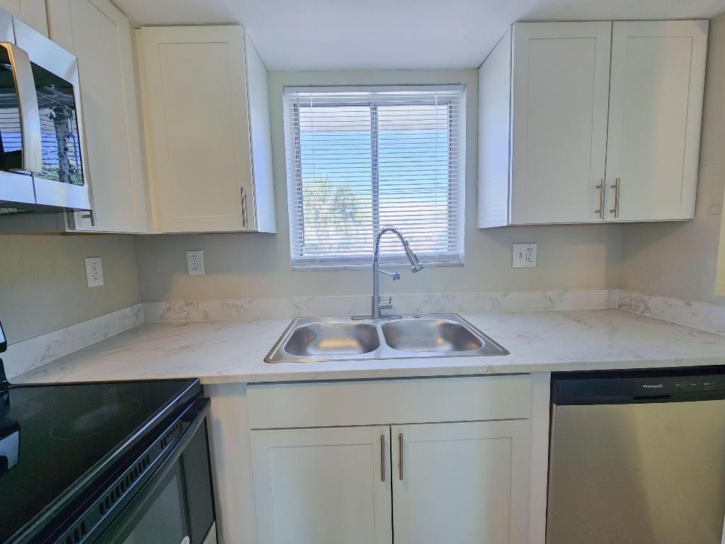 Photo of 1501 Crescent Circle #E40, Lake Park, FL 33403 (MLS # R11150325)