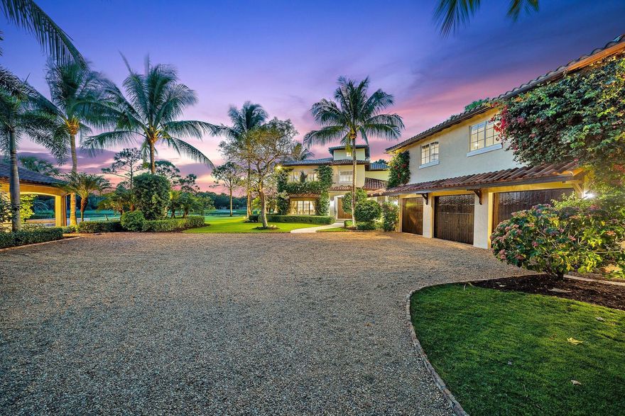 Spectacular estate situated on approx. 1.2 acres in the prestigious Trump National Golf Club, Jupiter. Overlooking the 12th fairway, water & green, this home offers over 7,100 sq.ft. of living space including a beautifully custom built main house featuring superior craftsmanship, an expansive gourmet chef's kitchen, wine cellar, large living spaces, high ceilings, an elevator and so much more. A luxurious private guest suite is set atop the 3-car garage. The spa inspired pool house boasts a sauna, steam room, gym, a full kitchen, cigar lounge & a wood fire pizza oven sets the mood for sunset dining. The meticulously maintained landscaping ensures complete privacy with beautiful lush gardens and putting green. An extensive indoor/outdoor living space makes this home an entertainer's dream.