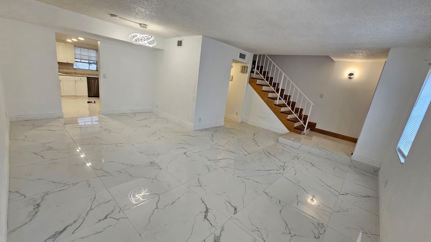 Newly remodel Open floor plan Large Format Tile throughout both floors. 3 bedroom 2.5 bath unit. Move in ready condition run don't walk. Conveniently located close to transportation, shopping mall, and schools. Large community Pool. New appliances thought.