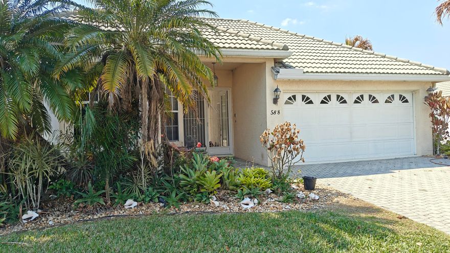 Welcome to this stunning 3-bedroom, 3-bathroom, 2-car garage St. Andrews model tucked away on a peaceful cul-de-sac in the highly sought-after Lake Charles community of St. Lucie West. Enjoy tranquil lake views and the privacy of a thoughtfully designed courtyard-style home that perfectly blends comfort and resort-style living.

This popular floor plan showcases the coveted courtyard concept, centered around a sparkling in-ground pool with spa — your own private oasis ideal for entertaining or relaxing. A charming tiki bar enhances the outdoor retreat, creating the ultimate Florida lifestyle setting. The detached guest suite features its own full bath, providing exceptional privacy for visitors, extended family, or the perfect home office. Inside, the spacious family room is highlighted by a cozy gas fireplace, creating a warm and inviting focal point for gatherings. All rooms are beautifully tiled, offering a clean, cohesive look along with easy maintenance throughout the home.

Residents of Lake Charles enjoy a manned, guard-gated entry and exclusive access to the beautiful Beach Club clubhouse, featuring a magnificent heated pool and spa, library, media center, lighted tennis and pickleball courts, basketball court, shuffleboard, bocce, horseshoes, playground, and picnic areas with BBQ grills. Scenic preserves, jogging and biking paths, and interconnected lakes (for non-gas-powered boats) provide endless outdoor recreation.

Association fees include landscape maintenance, basic cable, and internet, offering both convenience and value.

Experience secure, amenity-rich living with breathtaking lake views in one of St. Lucie West's most desirable communities.