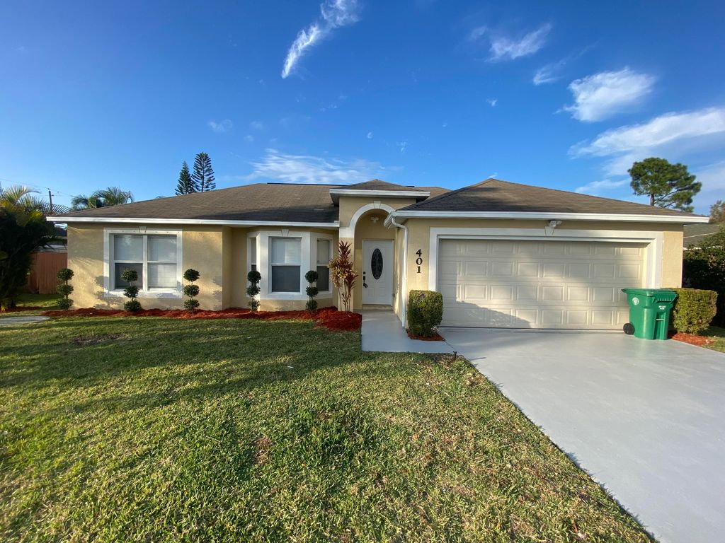 Photo of 401 SW Buxton Avenue, Port Saint Lucie, FL 34983 (MLS # R10776223)