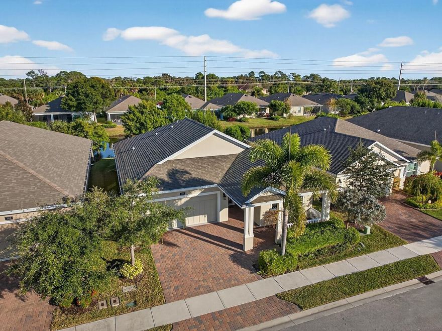 Discover true waterfront living in Sandcrest Sebastian with this beautifully upgraded 2020 home offering 2 bedrooms plus a versatile flex/den, 2 bathrooms, and a 2-car garage. Wake up every day to peaceful lake views and enjoy the comfort of brand-new carpet in the bedrooms paired with gorgeous LVP wood-style floors throughout the main living spaces. French doors lead to your flex room--perfect as a 3rd bedroom, office, or cozy retreat. Custom ceiling fans with remotes and thoughtful touches add comfort and style throughout.The kitchen features crown molding, quartz countertops, and an LG refrigerator with craft-ice--ideal for entertaining. The laundry room is fully equipped with a steam washer and dryer, utility sink, and added cabinetry for effortless storage. Step outside to your