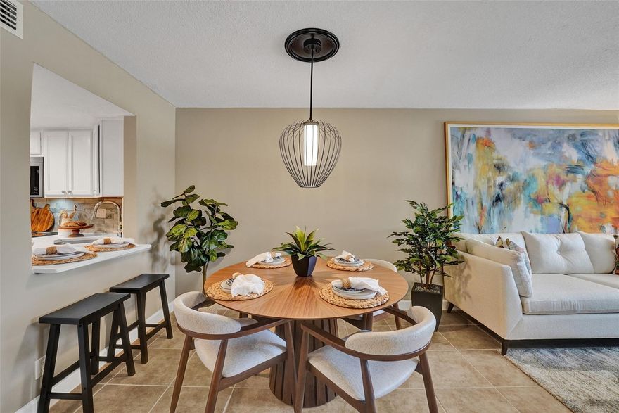Welcome to this beautifully completely updated, move-in-ready condo featuring 2 spacious bedrooms, 2 modern bathrooms, plus BONUS den—perfect as a home office or even a 3rd bedroom. The interior showcases custom wood accent walls that add warmth and character throughout. Enjoy a fully renovated kitchen with beautiful white cabinetry, Quartz counter tops and brand-new stainless steel appliances, along with totally updated bathrooms featuring stylish finishes. Full IMPACT WINDOWS and a newer A/C (2020) provide comfort and peace of mind all year long. Private storage unit included.  Located in a well-maintained pet-friendly community with large pool and spa has a low HOA of just $352/month. Centrally situated near shops, dining.   **NO RENTALS ALLOWED**