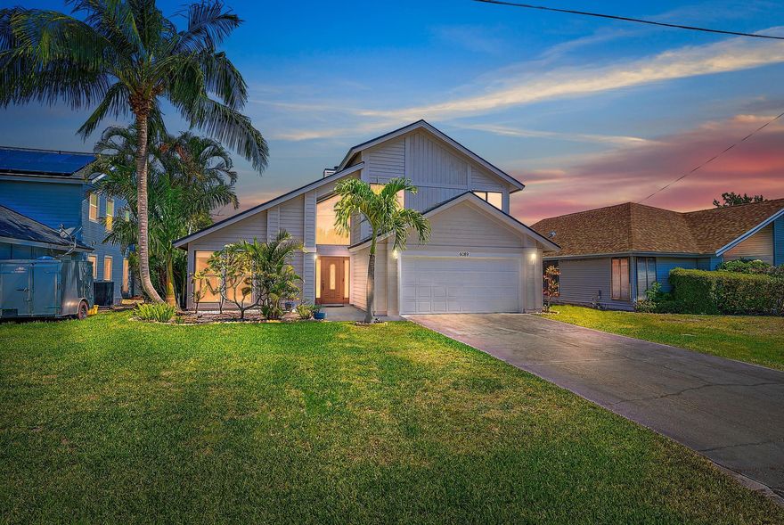 Welcome to one of the largest and most versatile floor plans in the Heights of Jupiter! This 4 bed, 3 bath, 2-story home features a full bedroom and bath on the first floor, ideal for guests or multigenerational living. Enjoy peace of mind with a brand-new roof and A/C (2025). Highlights include vaulted ceilings, a cozy living room, a family room with wood-burning fireplace, and a kitchen ready for your personal touch. Upstairs, the spacious primary suite offers a tray ceiling, custom walk-in closet, and large en-suite with dual vanities, soaker tub, and shower. Two additional bedrooms share a guest bath. The fenced yard and patio provide the perfect outdoor retreat, all in a vibrant, no-HOA community near top schools, parks, and shopping.
