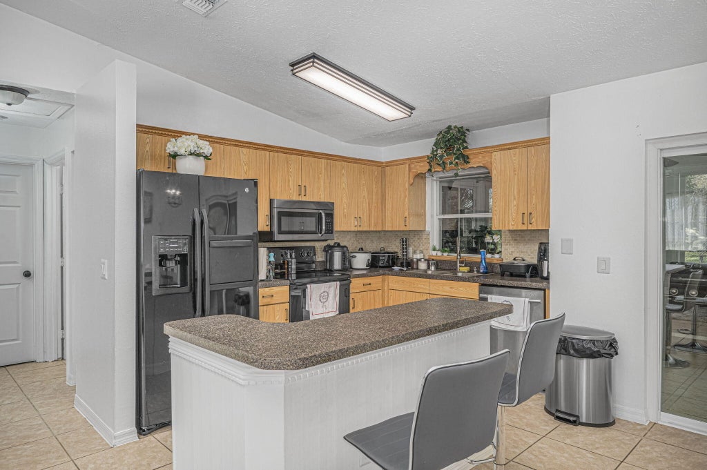 Photo of 1483 SW Del Rio Boulevard, Port Saint Lucie, FL 34953 (MLS # R10949624)