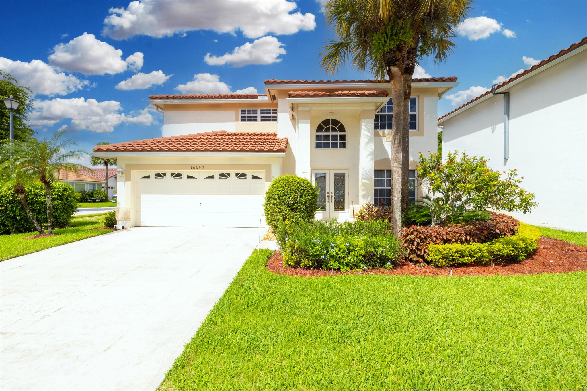 This beautiful 4 bedroom, 2.5 bathroom, 2-car garage home is resting on a corner lot in the coveted Boca Chase community with LOW HOA in an A-rated school district. The home features all IMPACT WINDOWS AND FRONT FRENCH DOOR. Recessed lights make the home feel bright and airy. The gorgeous, open concept kitchen was remodeled, and is equipped with upgraded cabinets, stunning calcite countertops, newer stainless steel appliances (2022), and an oversized island. The primary bedroom offers a walk-in closet with custom built-ins. The primary bathroom is finished with dual sinks, corner tub, and a separate shower. Half bathroom is located downstairs for your guests' convenience. Other notable features include 2018 tile roof and rain gutters, 2022 HVAC, 2020 rescreened patio with cool deck patio