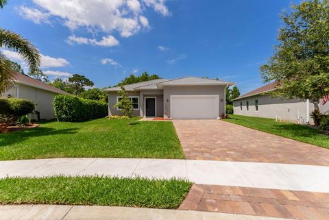 Photo of 675 NE Moss Rose Place, Port Saint Lucie, FL 34983 (MLS # R11092888)