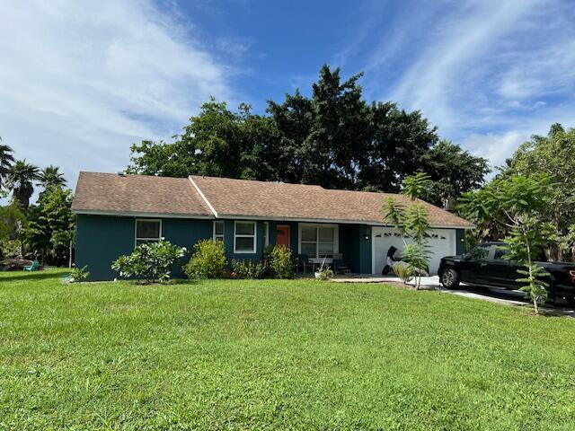 Lovely CBS home on 1.15 acres just off Apache Blvd! Lots of tall mature palm trees provide a relaxing tropical retreat for weekend serenity. 3 bedrooms, 2 bathrooms, screened patio and additional open patio. Remodeled kitchen and bathrooms, tile floors. Garage has been converted allowing lots of space to entertain.All sizes are approximate.School information taken from public information, buyer to confirm.
