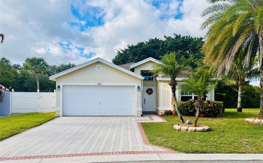 LOW HOA! Excellent home!! Guard gated neighborhood. 2017 Roof. 2019 AC.  Open Design floor plan with vaulted ceilings. Foyer entry hallway that opens to kitchen and family room. Large master suite with beautiful master bath with travertine floor. Guest bath with travertine floor. Large screened and tiled back patio with a manicured back yard with peaceful lakeview and room for a pool. Tiled 2 car garage. Sprinkler system supplied from the lake. Permitted Accordion Shutters. Pet and kid friendly neighborhood. Near shops and schools.