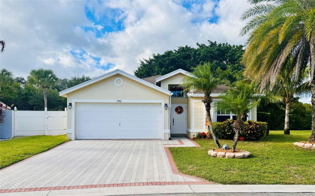 Photo of 1792 Sawgrass Circle, Greenacres, FL 33413 (MLS # F10530681)