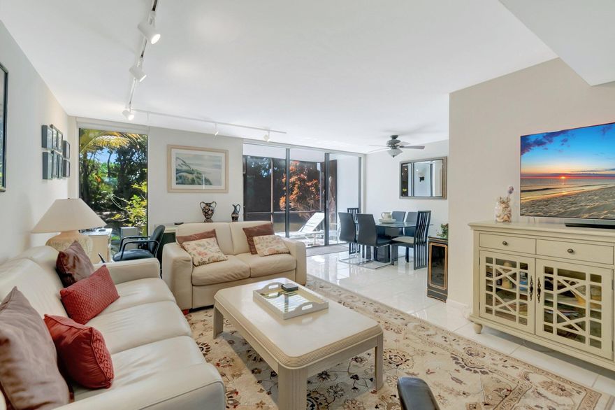 Located behind the gates of Boca West Country Club, this bright, fully-furnished, turnkey unit features lake views from the living room, kitchen, and primary bedroom. There is ample storage space, a pull-out sofa in the living room, a laundry room with a full-size washer and dryer, and two patios to enjoy the Florida weather. Welcome to your off-seasonal, vacation home. Available from May 1st, 2026-December 15th, 2026, no membership.