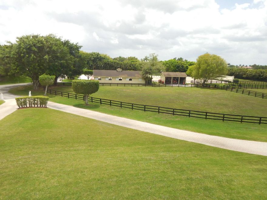 10+ acre working farm on paved Southshore Blvd. 2-story, 7,700+ sq. ft. home with screened courtyard pool and extensive entertainment area. 2 barns - 12 stalls and 5 stalls. Wash racks, grooming stall, grooms apartment, tack and feed. Ring with mirrors. Fenced paddocks.