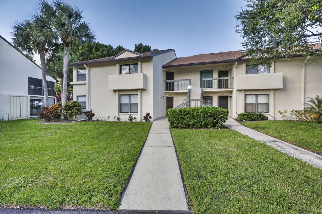 Photo of 3326 Perimeter Drive, Greenacres, FL 33467 (MLS # B26091146)