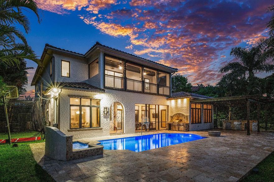 ONE-OF-A-KIND ESTATE IN PARKLAND GOLF & CC W/ STUNNING FAIRWAY & LAKE VIEWS. Expanded Minorca model featuring 6BD, 4/2BA on oversized lot. Primary on main floor w/oversize closet. Remodeled & upgraded. new quartz kitchen counters, double oven, white cabinetry, SS appliances, custom wood wall unit, marble in family room, built-in bar, new flooring in main living areas, contemporary fixtures & window treatments, coffered wood ceilings, wood stairs w/ wrought iron rails, & 2 balconies.
Resort-style outdoor living w/ remodeled pool & patio, marble pavers, fire pit, summer kitchen. 6th bedroom doubles as game room or 2nd Primary. Generator &NEW ROOF. Parkland Golf & CC offers world-class amenities: 10 tennis courts, 3 restaurants, full-service fitness, child care, pickle, basketball,& 3 pools