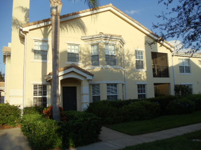 First floor corner unit with 2 car garage in gated community with club house, pool, exercise room and children playground.Tile and wood laminate throughout, granite kitchen with stainless appliances and pantry, interior laundry room and hallway with built in desk. This unit is light and bright with a sunny dining area and bright kitchen, impact windows and alarm system. HOA requires buyer to pay a Capital Contribution of $594 at Closing.