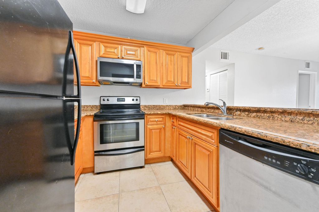 Photo of 1445 Lake Crystal Drive #F, West Palm Beach, FL 33411 (MLS # B26016123)