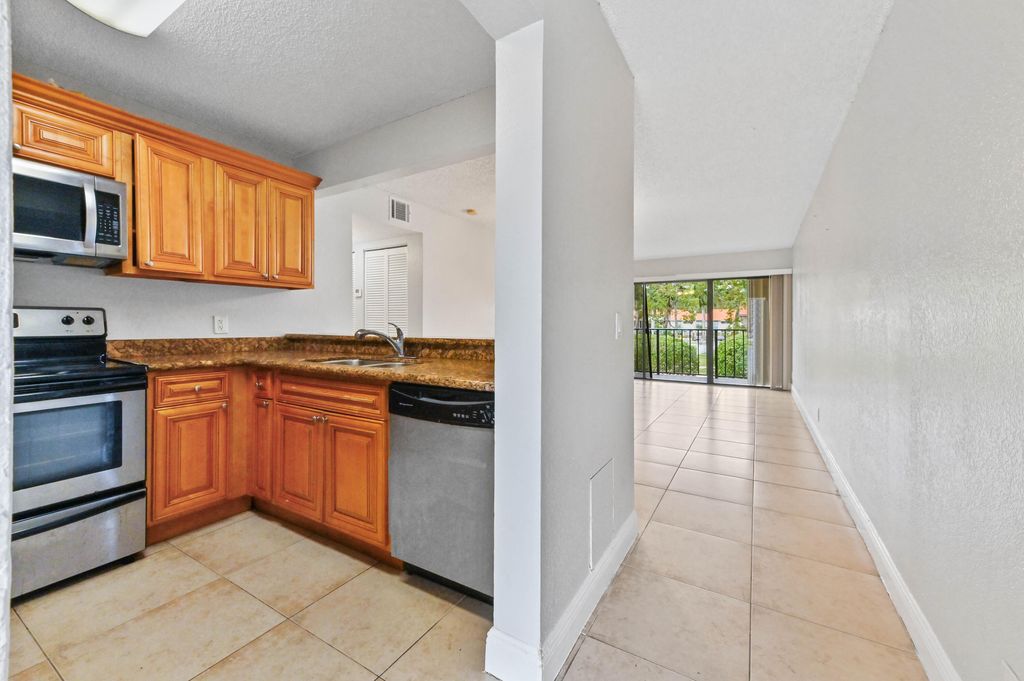 Photo of 1445 Lake Crystal Drive #F, West Palm Beach, FL 33411 (MLS # B26016123)