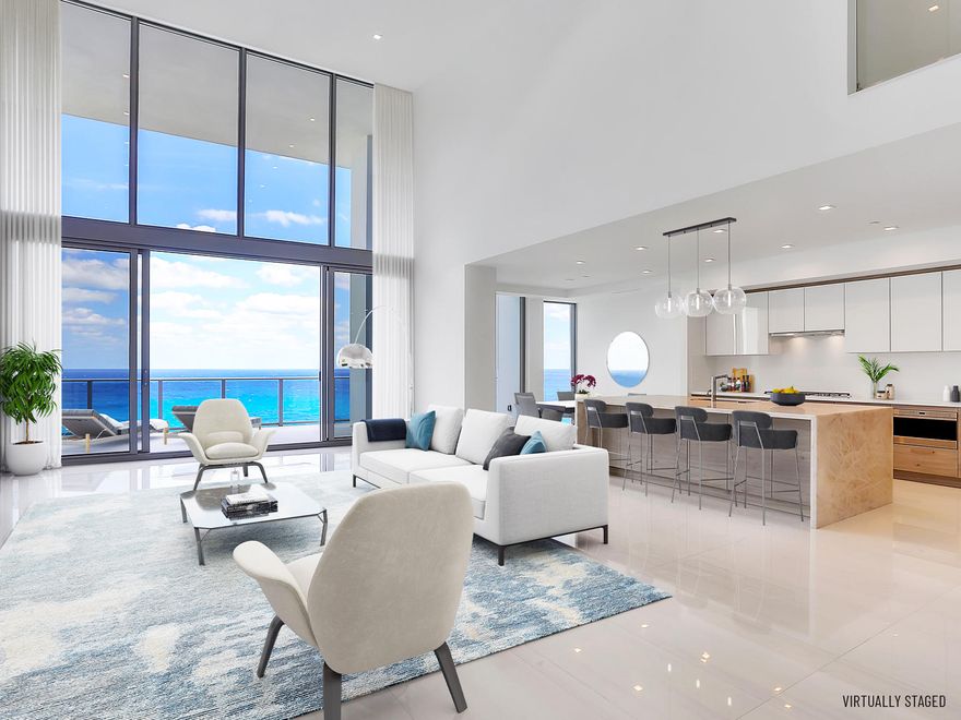 Welcome to next-level luxury in this rare 2-story, direct oceanfront residence with 4 beds, 4.5 baths, 4,897 interior sq. ft. and family room.  As one of only 48 residences at the newly completed boutique 5000 North Ocean, a private elevator entrance reveals ocean views through a soaring 20' high glass wall.  You will love the expansive terrace overlooking direct views of the ocean and 340' of Singer Island beachfront. Includes three assigned garaged parking spaces & climate controlled storage locker.  5000 North Ocean provides a gracious lobby with full time reception & concierge services, club room, state-of the art fitness center, south facing oceanfront pool with sun all day, a secluded beach & cabana with fireplaces for entertaining.  Pet friendly. Others Available. Beautifully finished and delivered furniture-ready with designer coordinated selections. Expansive walls of glass, innovative architectural designs and crisp modern interiors combine to create an unprecedented coastal lifestyle.  
Elegant, large format porcelain flooring (24X48) throughout with 8' solid core interior doors.  
The designer kitchen features European cabinetry with the latest storage systems and integrated LED lighting. A large Cristallo Quartzite island with waterfall edges, Pure White Quartz countertops and full-height backsplashes.  Wolf and Subzero appliances include a 30' refrigerator and 18" freezer column, gourmet 5-burner GAS-cooktop with 36" retractable stainless-steel canopy hood, under-counter microwave drawer, double wall ovens with warming drawer.  The bar area provides both a wine cooler & beverage center.  The second floor also has a bar area with sink, dishwasher, and beverage center.  
Owner's suite includes expansive closet space.  The bath finishes incorporate Lux High Gloss White European cabinetry, Mystery White marble countertop, with Grohe fixtures, Kohler sinks, and Toto toilets.  Guest baths appointed with same level finishes. 
There are two laundry rooms both upstairs and downstairs with upper & lower European cabinets with large capacity Electrolux front load washer & dryer. 
Truly a unique property with significant space flexibility, including an elevator that is accessible from both floors.