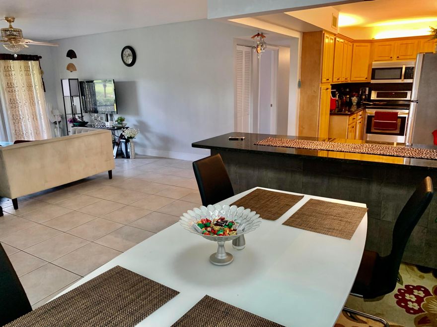 Experience elevated living in this beautifully renovated 3-bedroom, 2-bathroom condo with serene lake views. Designed with elegance and comfort in mind, this residence features accordion shutters, a custom statement chandelier, and a modern LED ceiling fan, complemented by a sophisticated color palette throughout. The fully updated kitchen is both stylish and functional perfect for everyday living and entertaining. Elegant tile flooring spans the entire unit, adding a clean, contemporary feel. Enjoy the convenience of a walk-in laundry room with a new washer and dryer, and water is included in the rent. Located in the desirable Palm Club all ages community, this condo offers an unbeatable location just minutes from the beaches, Palm Beach Outlets, City Place, Gardens Mall, the Ballpark