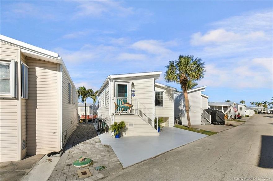 Welcome to Paradise! Your waterfront oasis awaits on sought-after Porpoise Island! This beautifully remodeled, canal-front home features a spacious deck perfect for entertaining, with room to add a boat lift for the ultimate waterfront lifestyle. Inside, enjoy luxury plank flooring, granite countertops, stainless steel appliances, new cabinetry, and stylish updated lighting and ceiling fans. The bathroom has been completely redone, and the home comes fully furnished in charming Key West décor with fresh window treatments. Move right in and start living the island dream! Located on Nettles Island, a guard-gated river community across from the Atlantic Ocean, offering two heated pools and more