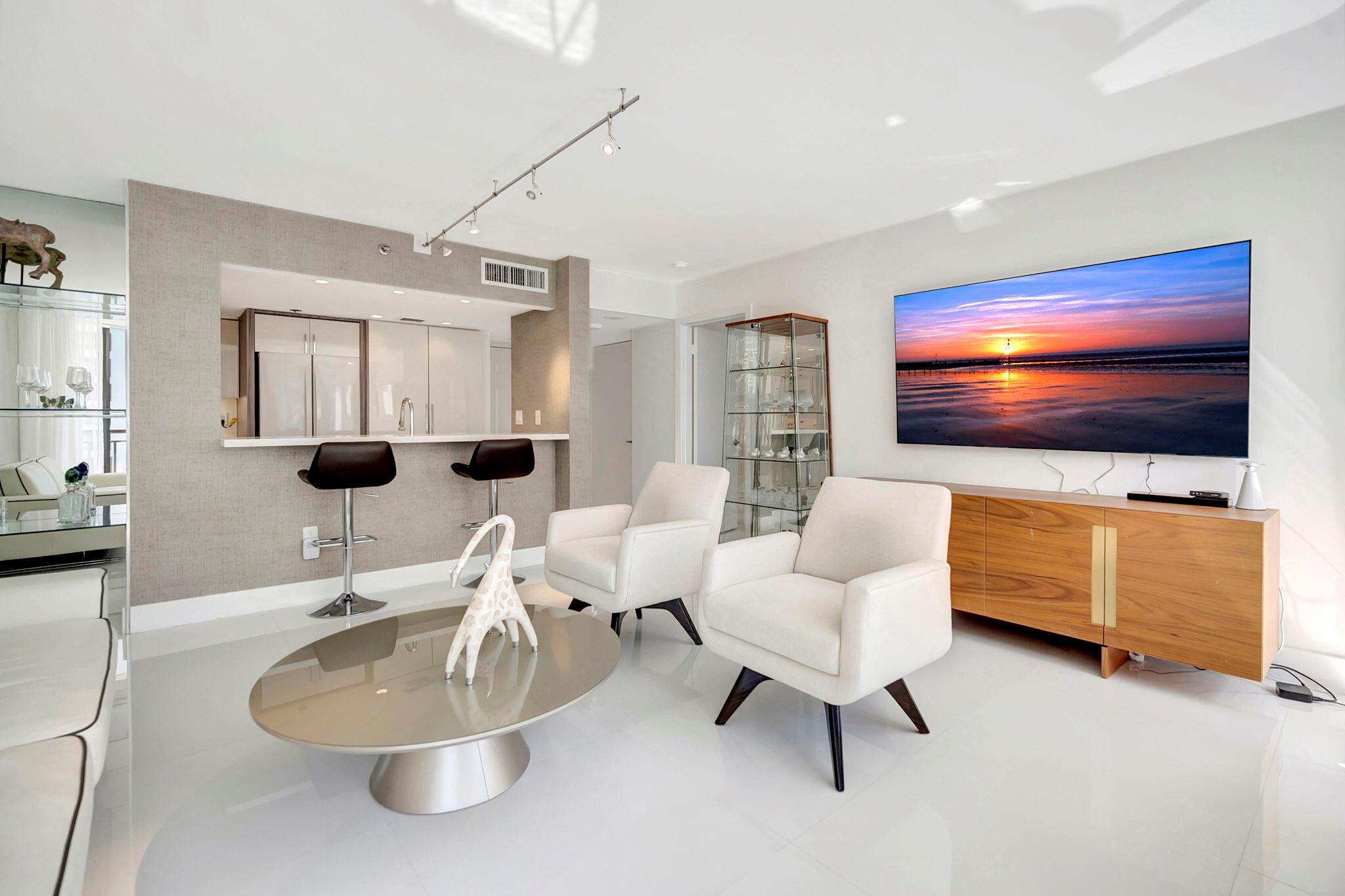 Experience Brickell Key living in this modern fully renovated 2 bedroom, 2 bath condo with stunning water views. Located in one of Miami's exclusive island communities. Steps from world-class shopping, dining, and entertainment, the building features a heated saltwater pool, Jacuzzi, fitness center, 24-hour concierge, and valet. Features include an in-unit washer and dryer and one parking space, with additional parking for rent. From the moment you enter you know you have found something special. Large format white marble tiles on the floor, modern furnishings, white and wood cabinets with quartz counters and marble baths make this the perfect home. Offer fully furnished turnkey. Owner will consider lease/purchase as well.