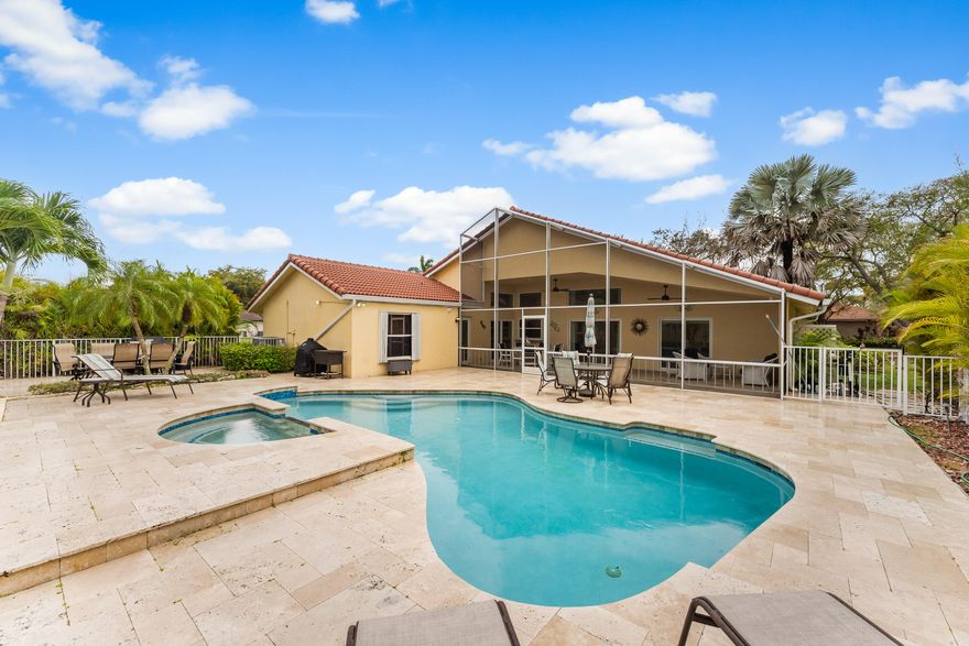 Welcome to this amazing home in the heart of Coral Springs. Located in the gated community of Carriage Pointe Estates, this 4 bedrooms, 2.5 bathrooms, pool home has over $100,000 in upgrades, from recently remodeled kitchen with new appliances and quartz countertop, bathrooms, to a whole house water filtration system, impact windows and doors, 2019 roof, travertine pavers in the driveway and back patio, extended patio, enclosed, a large back yard oasis, with a newly resurfaced salt water pool with jacuzzi. A/C and water heater were replaced in 2017, newer electrical panel, 8 outdoor cameras and ADT security system.