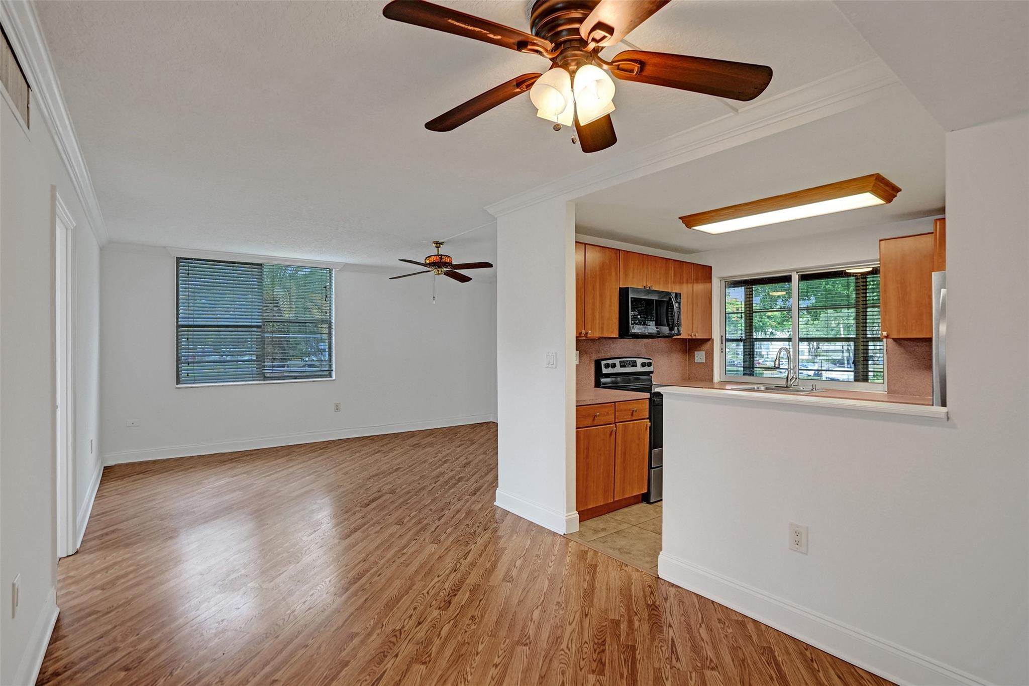 Private and spacious 2BR/2BA corner-unit condo in a welcoming 55+ community! This split floor plan offers comfort and privacy, featuring an open layout, stainless steel appliances, and bar seating in the kitchen. The glass-enclosed patio with a serving window is perfect for relaxing or entertaining. Enjoy a peaceful setting with plenty of natural light. Community amenities include a pool and tennis courts. Conveniently located near Colony West Golf Club, shopping, dining, and major highways. Pets are welcome!